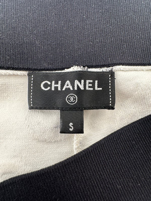 Chanel 22S White 
Black Logo 
Camellia Print Crop Top 
Shorts Set with Black Trim 
Metallic Applique Details Size S (UK 8)