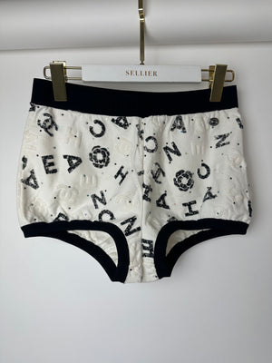 Chanel 22S White 
Black Logo 
Camellia Print Crop Top 
Shorts Set with Black Trim 
Metallic Applique Details Size S (UK 8)