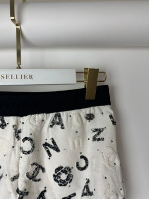 Chanel 22S White 
Black Logo 
Camellia Print Crop Top 
Shorts Set with Black Trim 
Metallic Applique Details Size S (UK 8)