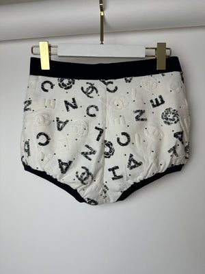 Chanel 22S White 
Black Logo 
Camellia Print Crop Top 
Shorts Set with Black Trim 
Metallic Applique Details Size S (UK 8)