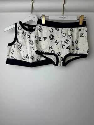 Chanel 22S White 
Black Logo 
Camellia Print Crop Top 
Shorts Set with Black Trim 
Metallic Applique Details Size S (UK 8)