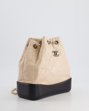 Chanel Nude, Black Mini Gabrielle Backpack in Aged Calfskin Leather with Ruthenium 
Brushed Gold Hardware