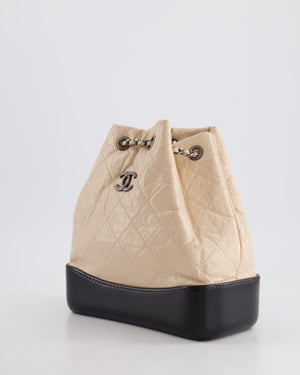 Chanel Nude, Black Mini Gabrielle Backpack in Aged Calfskin Leather with Ruthenium 
Brushed Gold Hardware